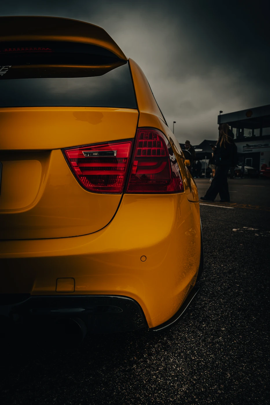 Sulge-up of yellow sports car rear lights at Augustfest 2025.