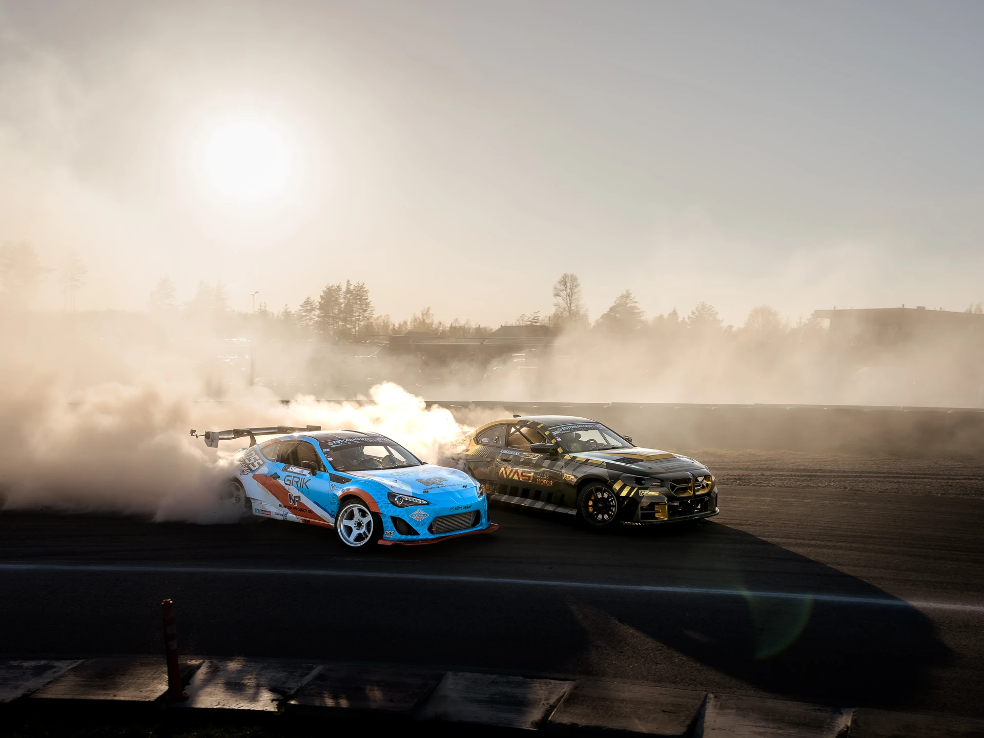Two drift cars side by side in tyre smoke at Raasilla RX, Mulgi Drift 2026.