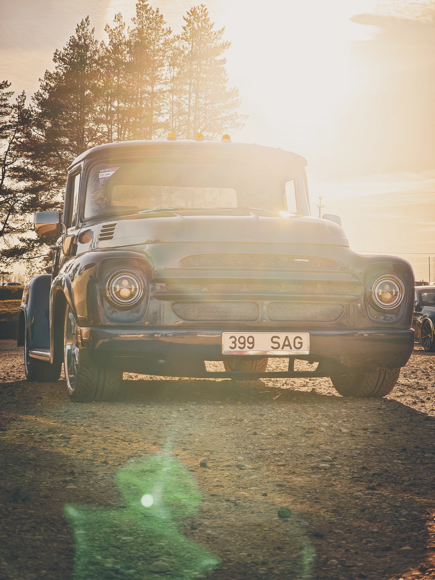 Vintage car parked in golden light at Mulgi Drift 2026.