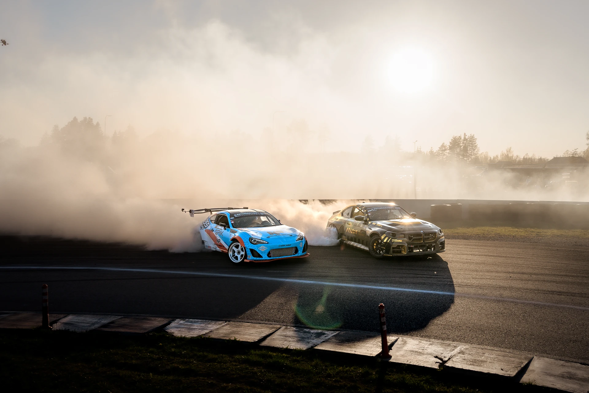 Tandem drift cars crossing a smoky corner at Mulgi Drift 2026.